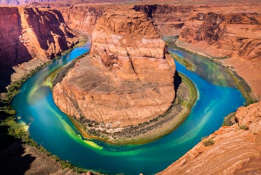 Horseshoe Bend above emerald Colorado River at sunset, Page, Arizona, United States
