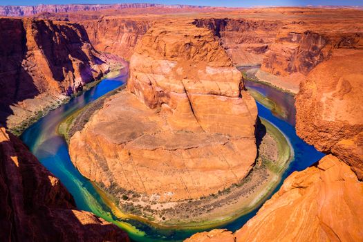 Horseshoe Bend above emerald Colorado River at sunset, Page, Arizona, United States