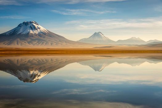 Idyllic Lake Lejia reflection and volcanic landscape in Atacama desert, Northern Chile, South America