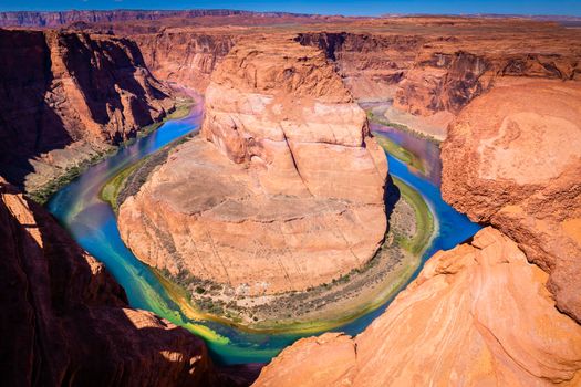 Horseshoe Bend above emerald Colorado River at sunset, Page, Arizona, United States