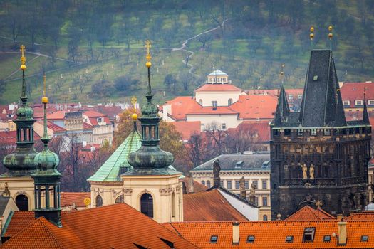 Above medieval Prague old town towers and domes at evening, Czech Republic