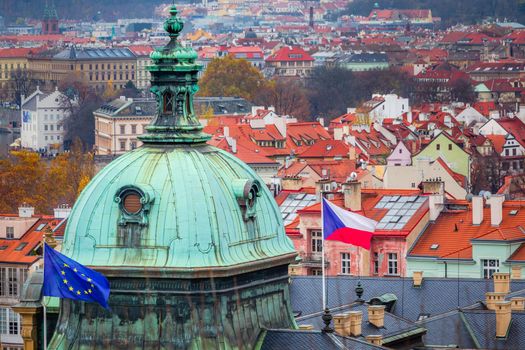 Above medieval Prague old town towers and domes at evening, Czech Republic