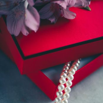 wonderful pearls in a red gift box, luxe present - jewellery and luxury gift for her styled concept, elegant visuals