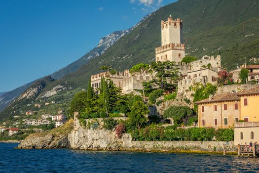 Idyllic Lake Garda in Malcesine old town coastline at sunset, Italian alps
