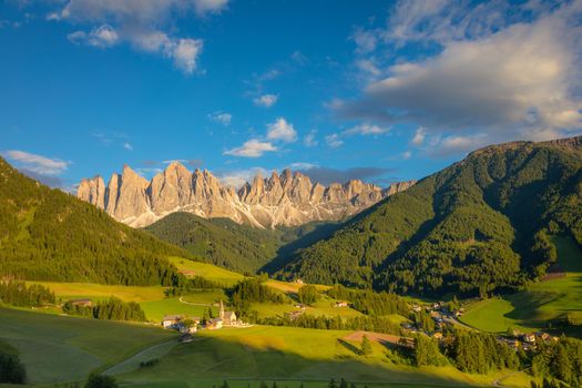 St. Magdalena village with famous church in Val di Funes at sunset, Dolomites , Italy