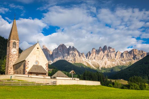 St. Magdalena village with famous church in Val di Funes at sunset, Dolomites , Italy