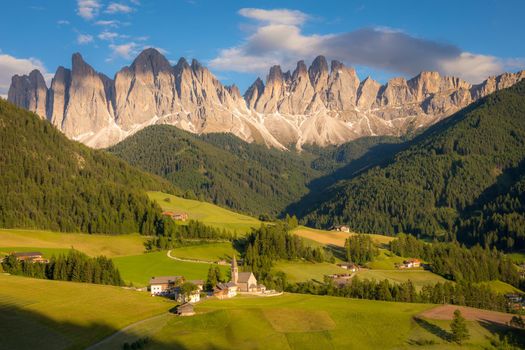 St. Magdalena village with famous church in Val di Funes at sunset, Dolomites , Italy