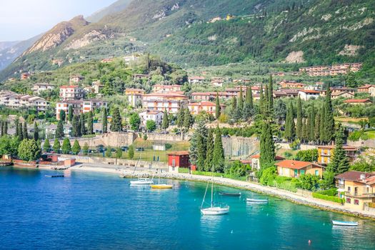 Above idyllic Lake Garda in Malcesine at brightly sunrise, Italian alps, long exposure