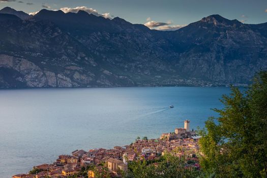 Above idyllic Lake Garda in Malcesine at dramatic dawn, Italian alps, long exposure