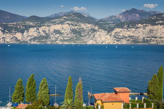 Idyllic lake Garda coastline in Malcesine and mountains, Northern Italy