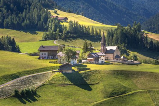 Idyllic St. Magdalena village with famous church in Val di Funes, Dolomites, Northern Italy