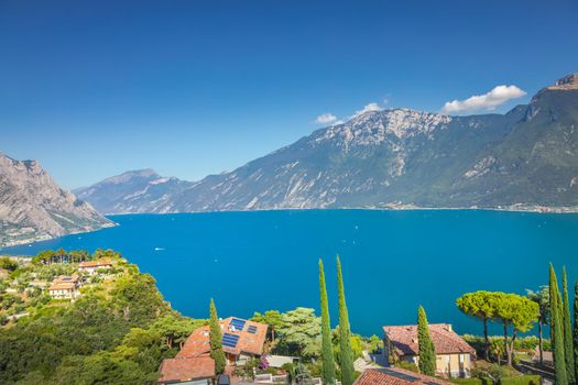Idyllic lake Garda coastline in Malcesine in Limone sul Garda and mountains, Northern Italy
