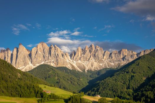St. Magdalena in Funes valley with pinnacles at dramatic sunset, Dolomites , Italy