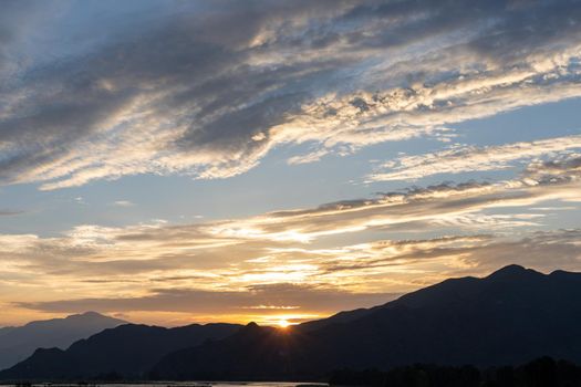 Sun Over Skyline horizon with warm colors at sunset or sunrise