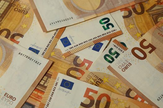 Pile of paper euro banknotes as part of the united country's payment system. Money close-up finance cash. Euro Money. euro cash background