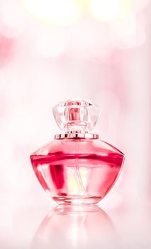 Perfume bottle on glamour background, floral feminine scent, fragrance and eau de parfum as luxury holiday gift, cosmetic and beauty brand present concept