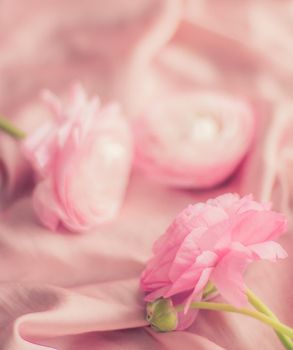 pink rose flowers on soft silk - wedding, holiday and floral background styled concept, elegant visuals