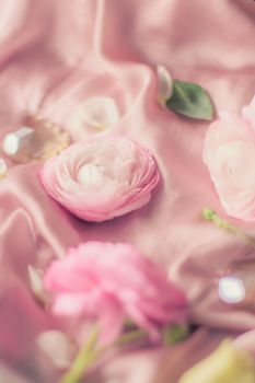 pink rose flowers on soft silk - wedding, holiday and floral background styled concept, elegant visuals