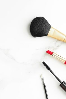 Make-up and cosmetics on marble, flatlay - modern feminine lifestyle, vlog background and styled stock concept. Beauty inspiration in a fashion blog