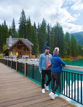 Emerald lake Yoho national park Canada British Colombia. beautiful lake in the Canadian Rockies during the Autumn fall season. Couple of men and women standing by the lake