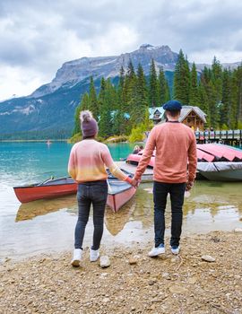 Emerald lake Yoho national park Canada British Colombia. beautiful lake in the Canadian Rockies during the Autumn fall season. Couple of men and women standing by the lake