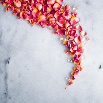 rose petals on marble flatlay - wedding, holiday and floral background styled concept, elegant visuals