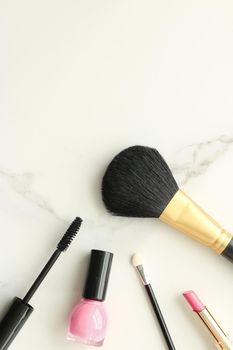 Make-up and cosmetics on marble, flatlay - modern feminine lifestyle, vlog background and styled stock concept. Beauty inspiration in a fashion blog