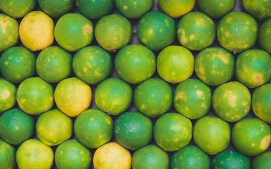 Full Frame Photo Of Fresh Green Mausami, sweet lemon For Sale In The Market, Fruit backgrounds