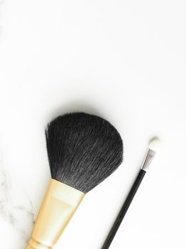 Make-up and cosmetics on marble, flatlay - modern feminine lifestyle, vlog background and styled stock concept. Beauty inspiration in a fashion blog