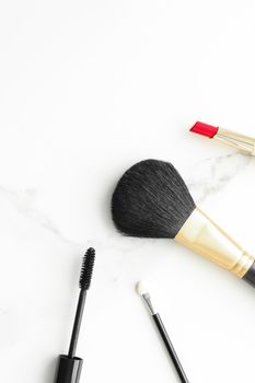 Make-up and cosmetics on marble, flatlay - modern feminine lifestyle, vlog background and styled stock concept. Beauty inspiration in a fashion blog