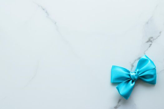 Holiday decor, feminine design and flatlay concept - Blue silk ribbon on marble, top view