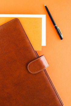 Modern workspace, productivity and corporate lifestyle concept - Luxury business brown brief-case on the office table desk, flatlay