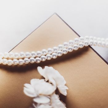 Valentine's day ideas, luxury shopping and holiday inspiration concept - Pearl jewellery in a vintage golden gift box