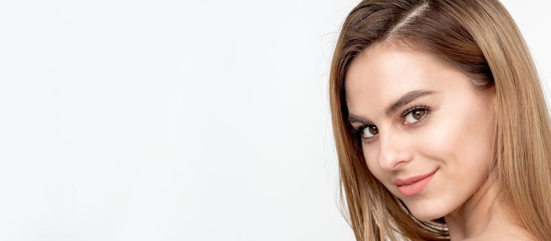 Face portrait of a beautiful young caucasian woman on a white background with copy space