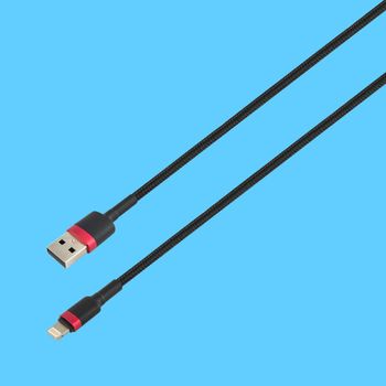 Cable with USB and Lightning connector, isolated on a blue background