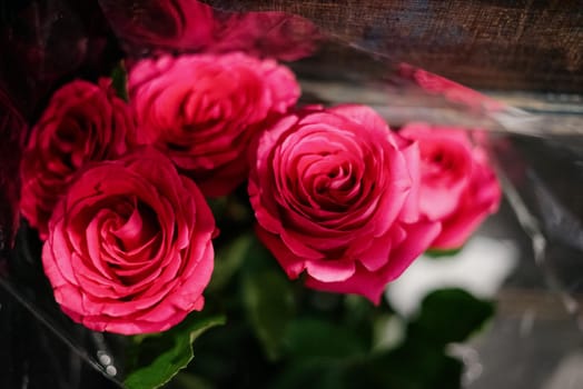 Red roses in a flower shop.Beautiful flowers for a catalog, online store. Flower business. Concept flower store and delivery.