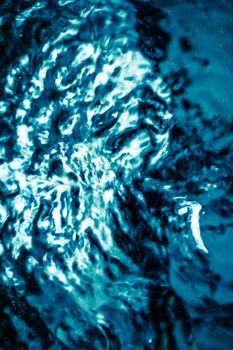 Abstract blue liquid surface as background - futuristic design and science concept. Deep blue waters