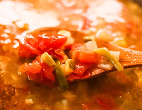 Cooking vegetable soup in saucepan, comfort food and homemade meal concept