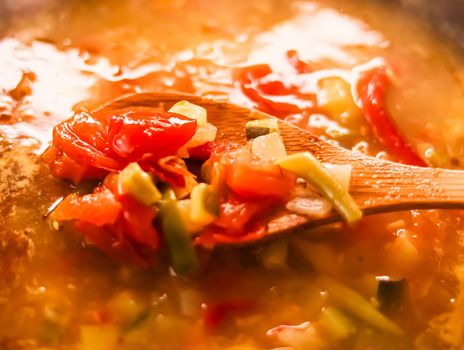 Cooking vegetable soup in saucepan, comfort food and homemade meal concept