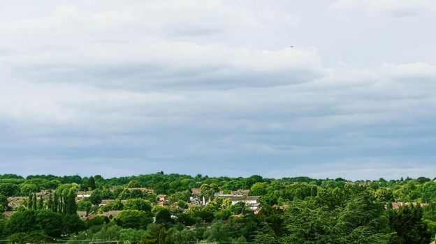 Beautiful English countryside landscape in Hertfordshire, England, United Kingdom, green foliage, villages and cloudy sky, weather and nature concept