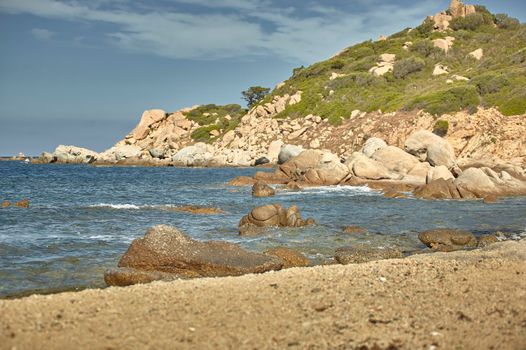 Rocks sprouting from the sea in the beautiful Mediterranean beach of Cala Sa Figu in the south of Sardinia.