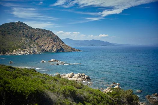 View of the Mediterranean sea surrounded by the indented coastline and rich in vegetation of the south of Sardinia.