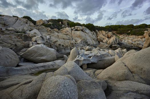 Detail of the southern coastline of Sardinia, precisely in the locality of Punta Molentis: a coastline with particular shapes given by the granite rocks that compose it shaped by the sea.