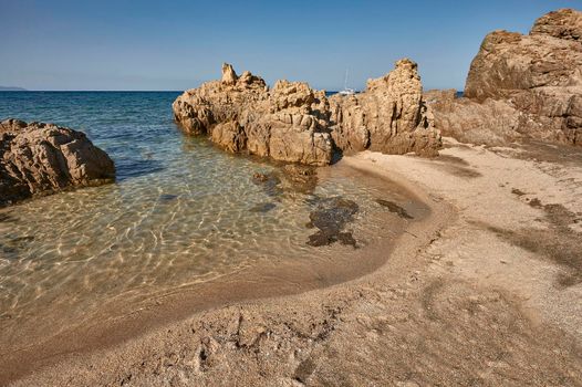 Rocks, crystal clear sea water and sun: the perfect symbol of a summer holiday in a true paradise.