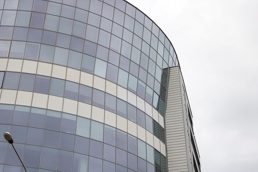Mirrored windows on a tall modern building close up
