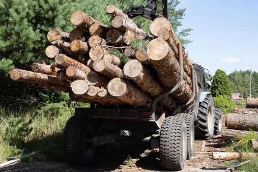The logs are folded on the tractor close up