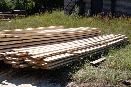 Folded finished boards at the sawmill close up