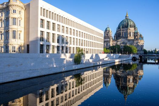 The rebuilt Berlin City Palace with the Cathedral reflected in the river Spree
