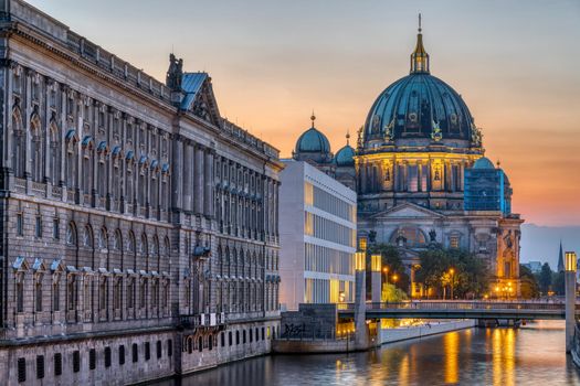 View along the RIver Spree in Berlin after sunset with the Cathedral in the back