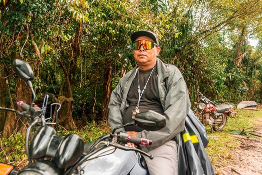 Indigenous man riding a motorbike in a Caribbean community of Nicaragua